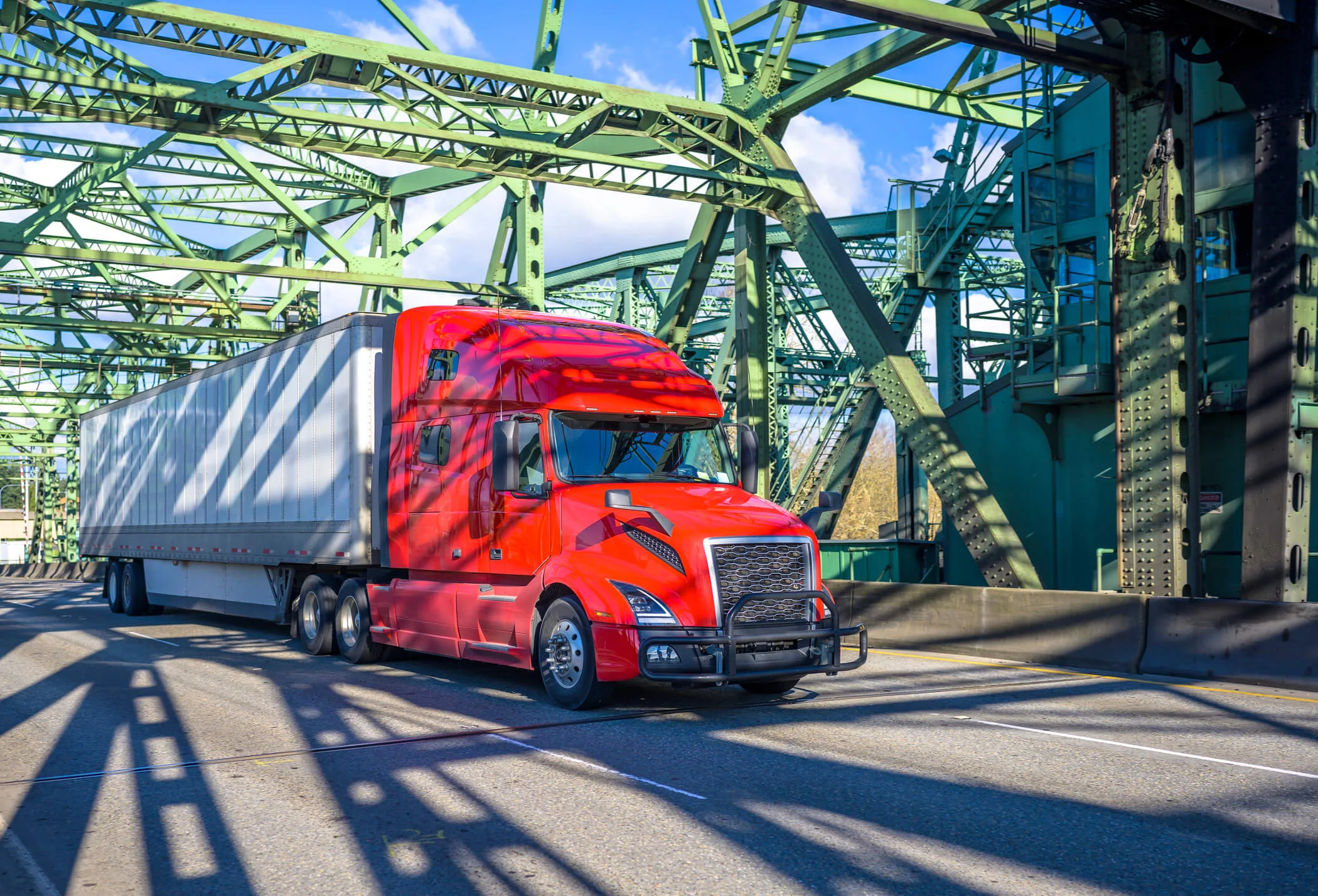 Semi truck driving over bridge