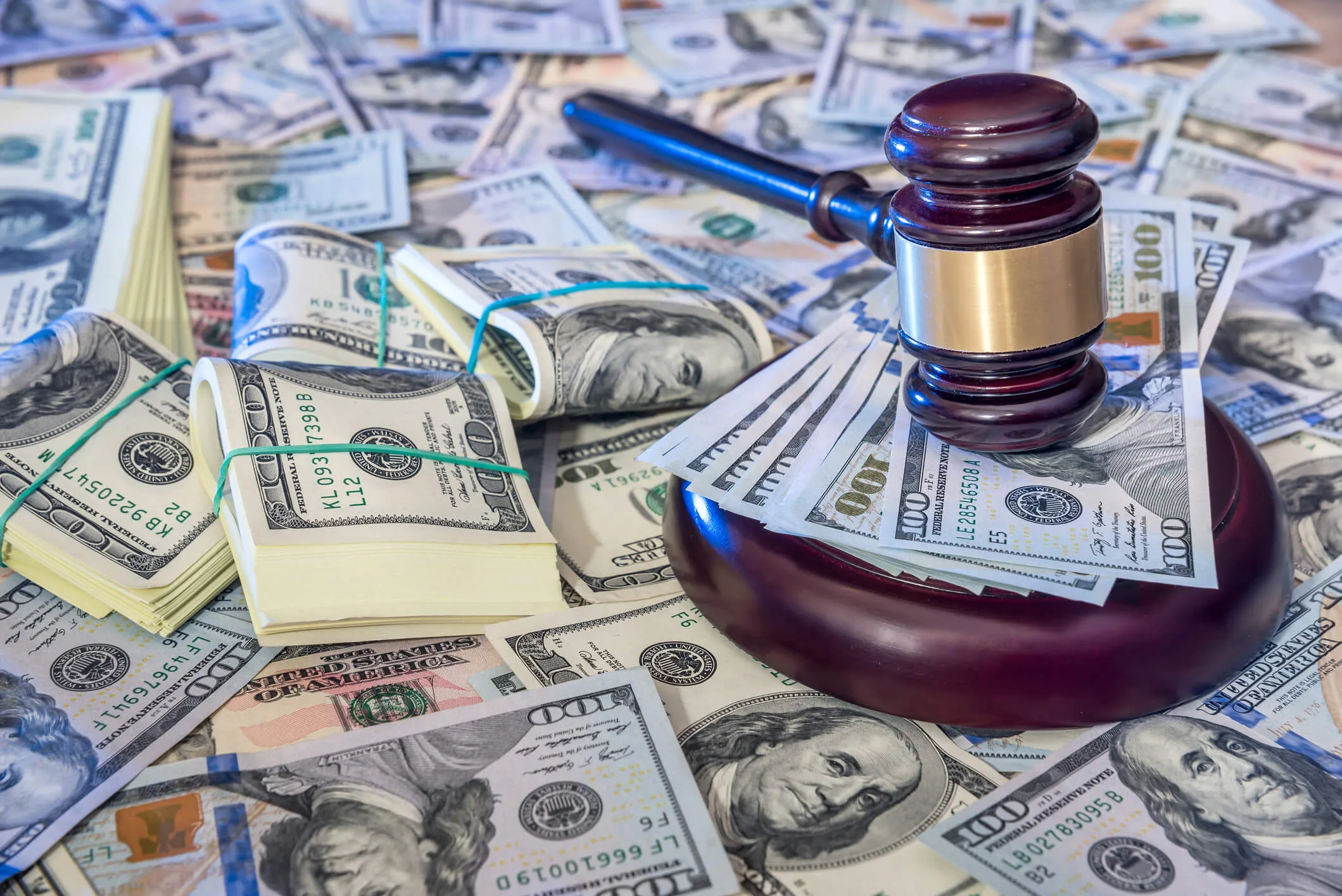 judges gavel against us dollar background