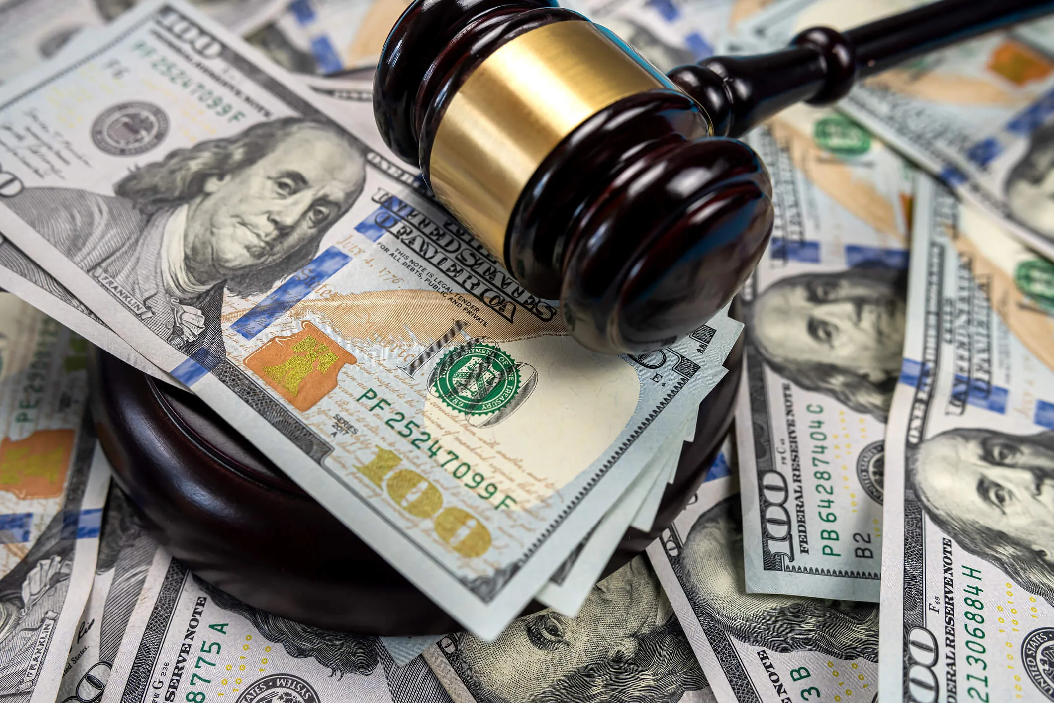 Gavel cash dollar bills