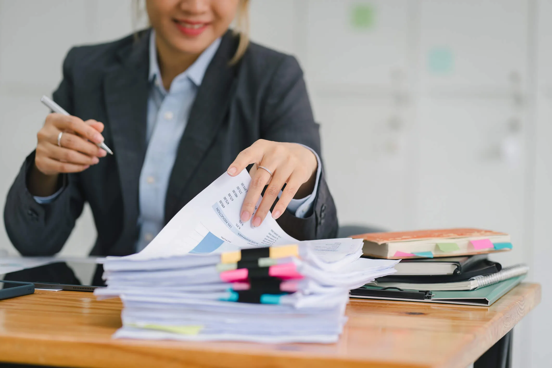 Female lawyer going through documents at her desk